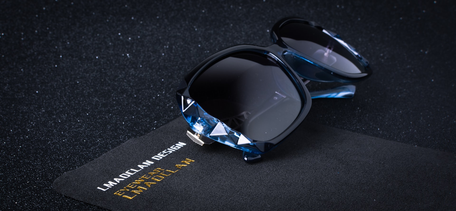 a pair of sunglasses sitting on top of a card